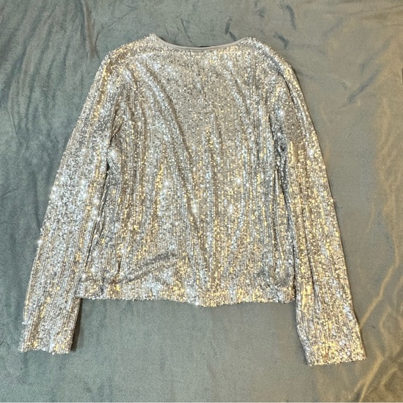 Ricki's Silver Sequin Long Sleeve Blouse

#1039 - Picture 7 of 7